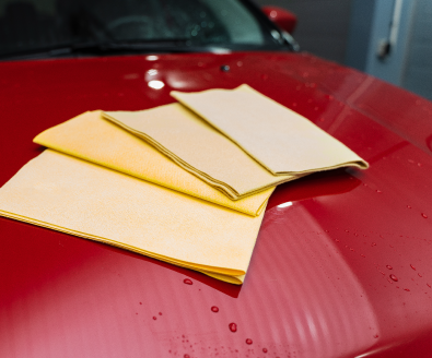 microfiber assortment cloths on the hood of the car.